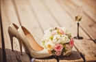 23107049 - close up of wedding bouquet and bride shoes