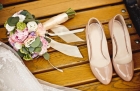 24045184 - close up of wedding bouquet and bride shoes