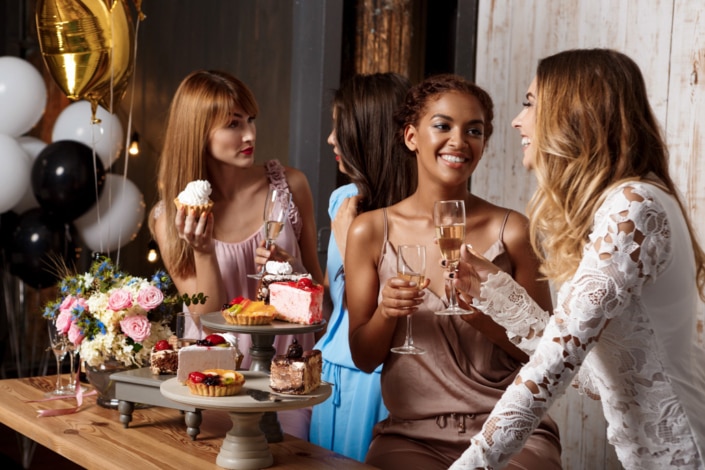 Four beautiful girls resting at party.